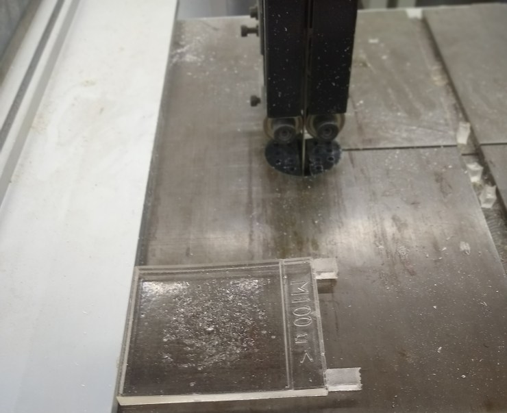 The resin cast of M100 in front of a band saw blade