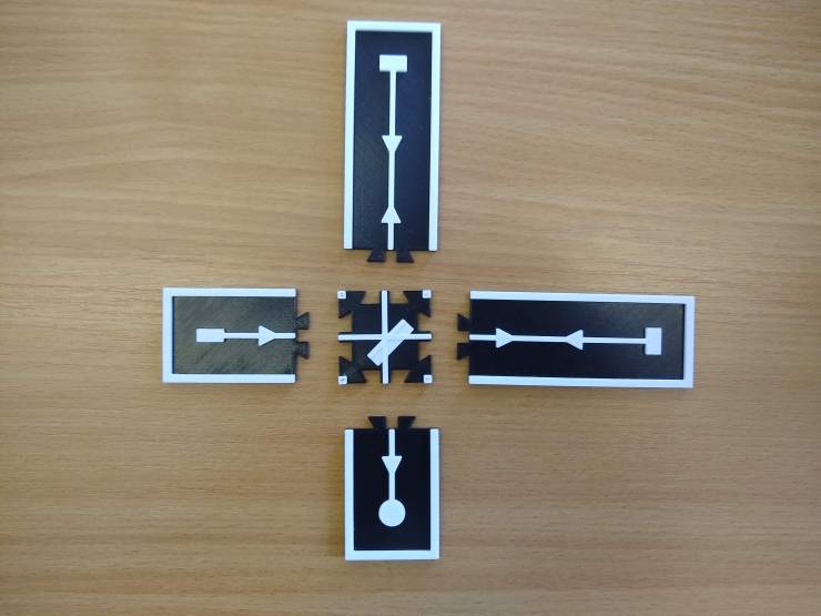 A tactile model of a Michelson interferometer split into 5 interconnecting pieces.